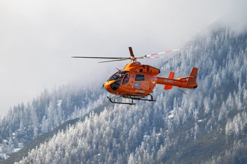 Rescue helicopter, emergency helicopter in flight, Schwaz, Tyrol, Austria, Europe