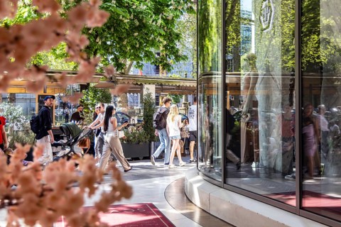 Königsallee Düsseldorf with passers-by. The Kö is one of the most luxurious shopping streets in