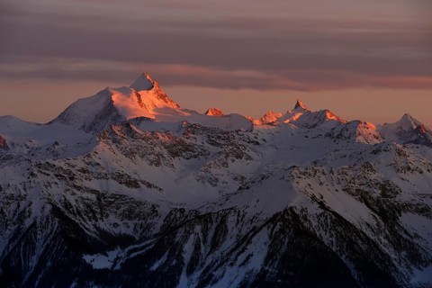 Sunset with Alpine glow over snow coverd mountains, Valais Alps, Switzerland, Europe
