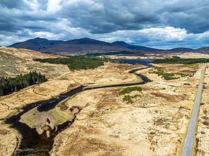 Mountains and Moors over Loch Tulla and River Orchy from a drone, Highlands, Scotland, UK