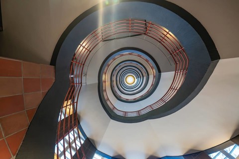 View from below through a spiral staircase with red banisters, SPRINKENHOF, Hamburg, Germany,