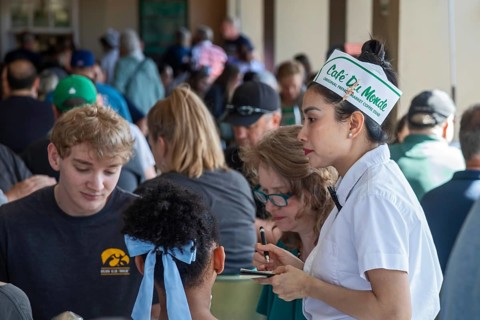 New Orleans, Louisiana - A server takes orders at Cafe du Monde. The coffee shop in the French