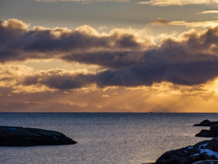 Morning atmosphere at the coast of Ballstad, behind the mountains of the mainland, Vestvagoy