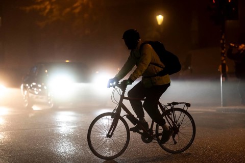 Cyclist, darkness, inner city traffic, fog, autumn, winter, evening traffic, North