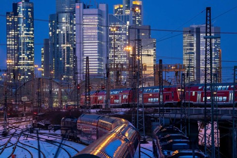 Railway tracks in front of the main railway station in Frankfurt am Main, skyline of skyscrapers in