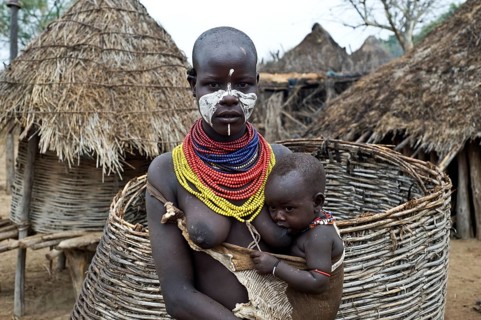 Portrait of a young mother and child from the Karo tribe, Omo valley, Ethiopia, Africa