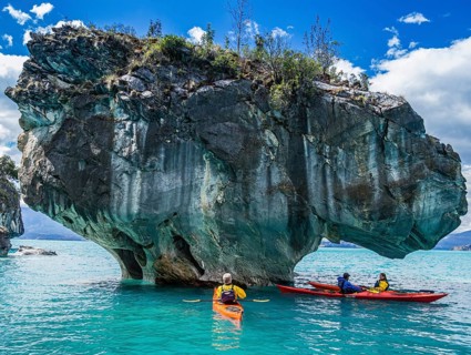 Paddling tourist in kajak at the marmor caves near Puerto Rio Tranquilo, a village at the Carretera