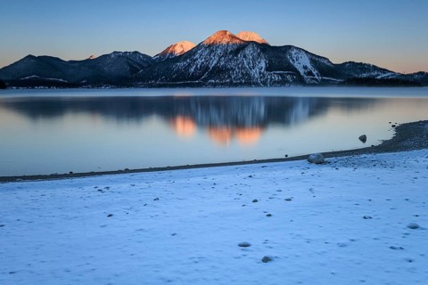 Sunrise over mountain lake, reflection, winter, Walchensee, view of Herzogstand and Heimgarten,