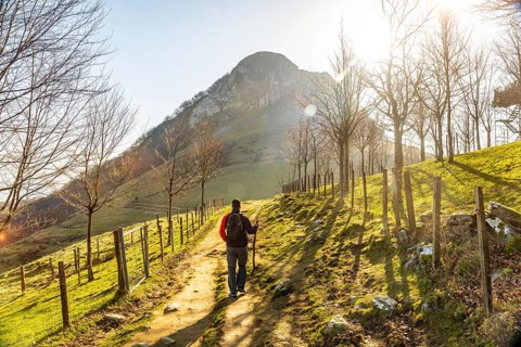 A man climbing the trek up Mount Ernio or Hernio in Gipuzkoa, Basque Country