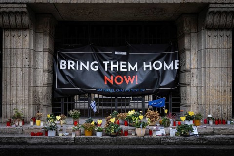 A BRING THEM HOME NOW! banner hangs in front of the Orthodox Synagogue in Frankfurt's Westend. It