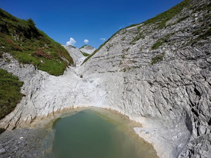 Glacier mill with glacier pots on the Trinser Alp Mora, Trin, Canton Graubünden, Switzerland,