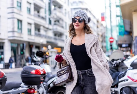Lifestyle, young Caucasian blonde girl enjoying the city in winter. Strolling with sunglasses and