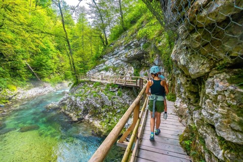 Mother and child enjoying a hike through the scenic vintgar gorge near bled, slovenia, walking