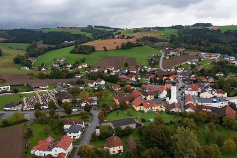 Drone shot, view of village with church, Enzenkirchen, Innviertel, Upper Austria, Austria, Europe