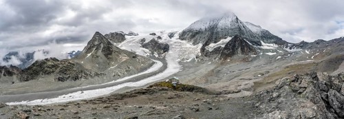 Panorama mountain hut Cabane des Dix in front of glacier Glacier de Cheilon and summit Mont Blanc