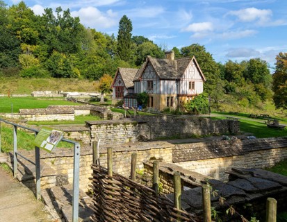 Overview of excavated walls and museum building, Chedworth Roman Villa, Chedworth, Cotswolds,