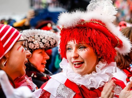 Colourfully costumed carnivalists celebrate carnival in Cologne, on Weiberfastnacht the street
