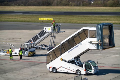 Dortmund Airport, DTM, apron, in front of the terminal, runway, mobile passenger stairs waiting for