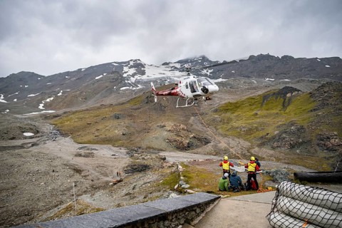 Air rescue operations in the mountains, rescue helicopter, Valais, Switzerland, Europe