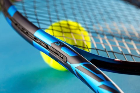 Tennis symbol: close-up of a tennis racket with tennis ball