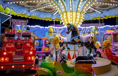 Horses, fire brigade on children's carousel, rides, neon lights, Cannstatter Wasen, funfair, spring