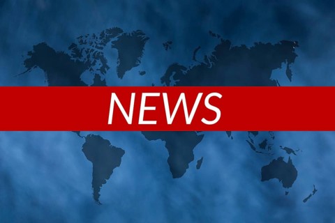 Text NEWS on blue background with world map
