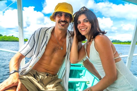 Tourists relaxing on a boat trip in siargao island, philippines, enjoying summer holidays and