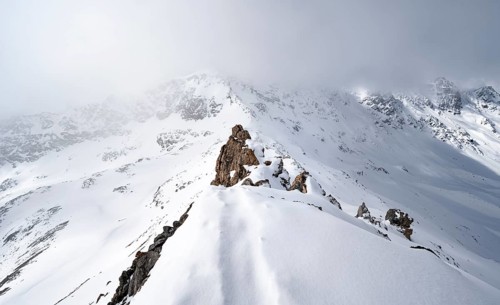 View of wintry mountain landscape on the ridge of Piz Laviner, Grisons Haute Route, Albula Alps,