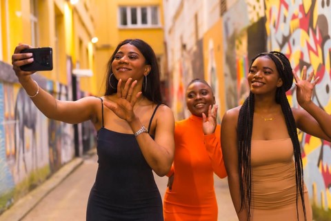 San Sebastián, Gipuzkoa Spain, February 2021: Three girls taking a selfie. Fashionable urban style