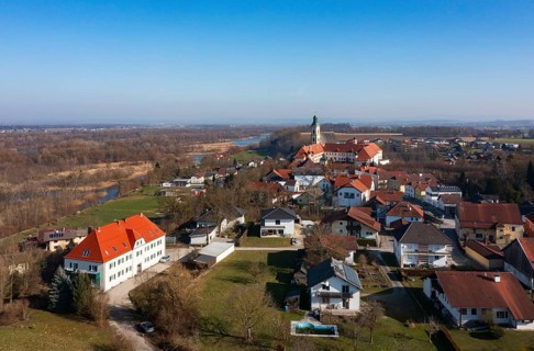 Drone shot, view of the village with Augustinian monastery Reichersberg, Reichersberg, Innviertel.