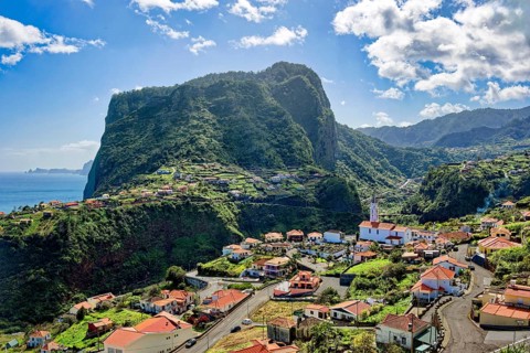 The village of Faial with a view of the landmark Eagle Rock from the Miradouro do Fortim viewpoint,