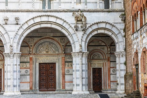 Arched entrance portals of the Cathedral of San Martino, historic city centre, Lucca, Tuscany,