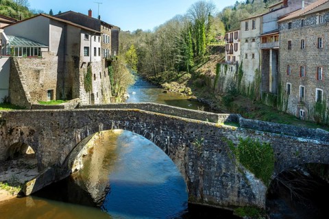 Olliergues village. Old bridge on river Dore. Natural regional park of Livradois Forez. Puy de Dome