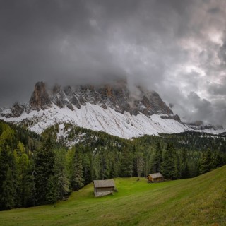 View of a part of the Geisler group in the foreground two mountain huts, Dolomites, snow,