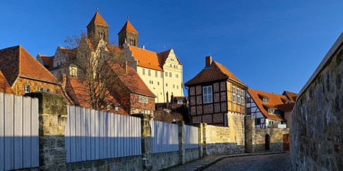 Half-timbered houses in Schenkgasse with St Servatius collegiate church, old town of the World