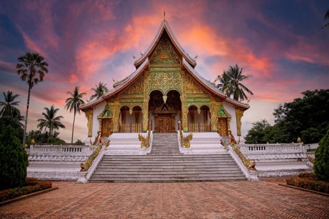 Lovely sunset at a lovely temple in Luang Prabang in summer, Laos, Asia