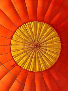 Hot air balloon inside view, top opens to release warm air before landing. Hot air balloon ride