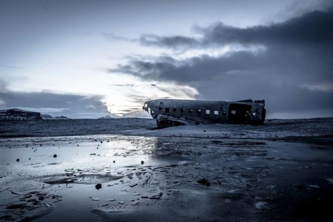 Plane wreck, crahsed plane on frozen Solheimasandur beach in winter with snow in Iceland