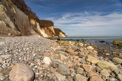 Beach and the chalk cliffs on the Baltic Sea coast in Jasmund National Park, Ruegen Island,