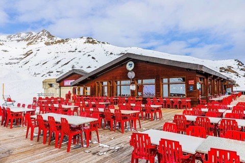 Free tables and chairs on the terrace of the Bendolla mountain restaurant, Grimentz, Val