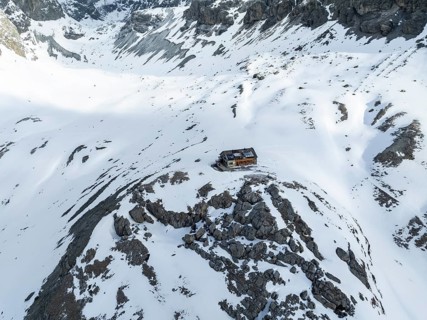 Aerial view, winter in the mountains, Chamanna Jenatsch CAS, Swiss Alpine Club hut, Val Beve,