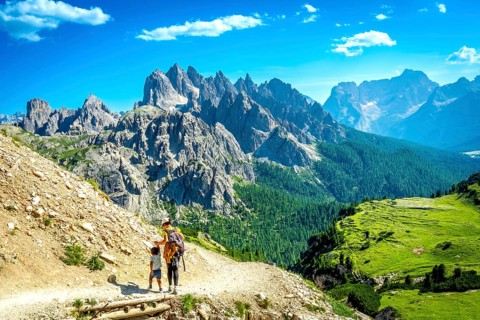 Tourists enjoying breathtaking views while hiking on a scenic trail in tre cime di lavaredo,