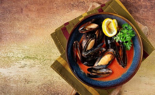 Fra Diavolo mussels, mussels in tomato sauce, Italian dish, on the table, top view, homemade, no