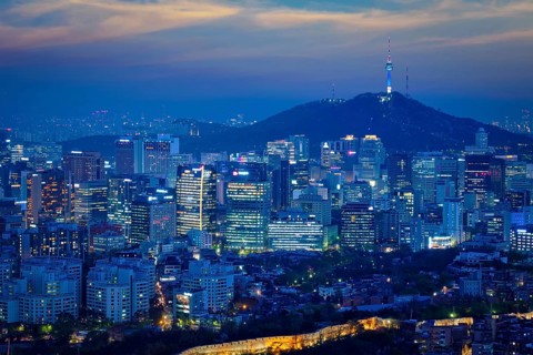 Seoul downtown cityscape illuminated with lights and Namsan Seoul Tower in the evening view from