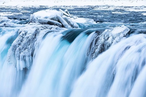 Godafoss waterfall, icy and snowy rock face, Northern Iceland Eyestra, Iceland, Europe