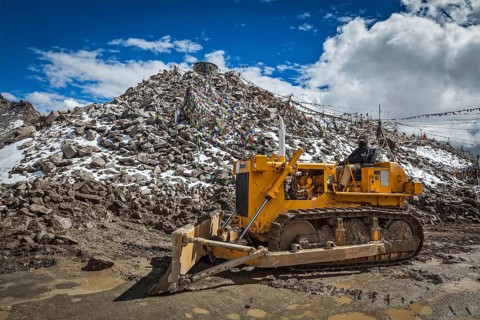 KHARDUNG LA PASS, INDIA, SEPTEMBER 12, 2012: Road construction at Kardung La, the highest motorable