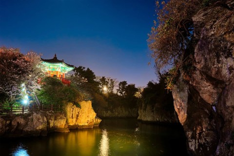 Scenic Yongyeon Pond with Yongyeon Pavilion illuminated at night, Jeju islands, South Korea, Asia