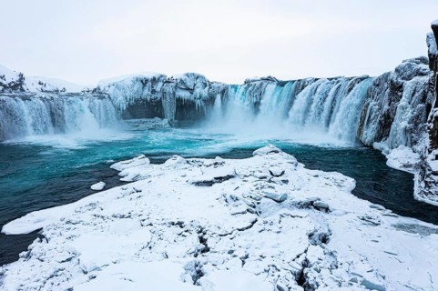 Godafoss waterfall, snowy landscape, drone shot, Northern Iceland Eyestra, Iceland, Europe