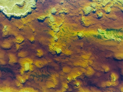Detail of the Rio Tinto (Red river) with its reddish hue due to oxidised iron minerals and other
