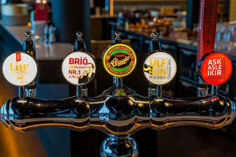 Illuminated beer tap at Hnoss Restaurant and Bar, Harpa Concert Hall and Congress Centre,